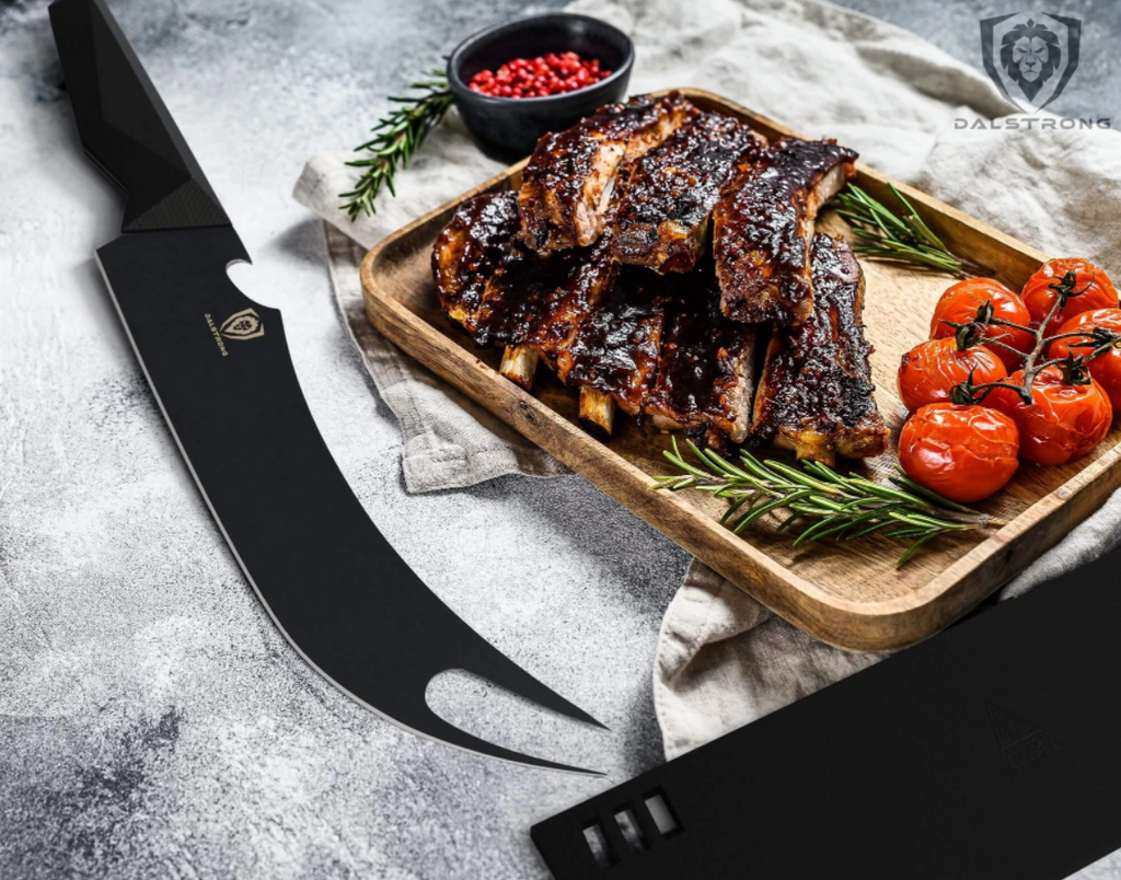 Stunning Dalstrong Shadow Black 9" Pitmaster Knife next to a wooden tray of deliciously grilled ribs with tomatoes and rosemary on the side.