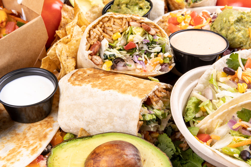 A selection of Mexican fast food including burritos and tacos