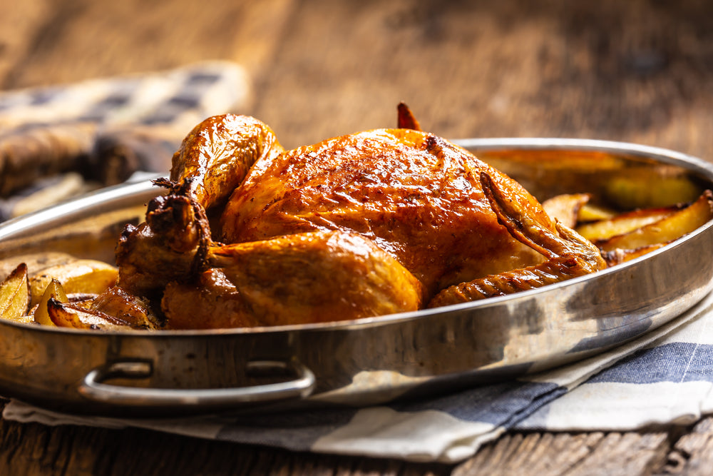 roasted turket surrounded by roasted potatoes