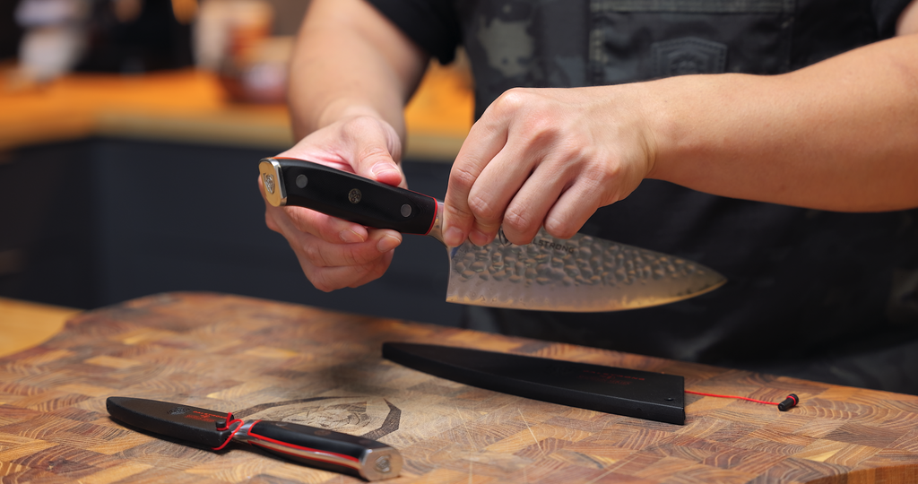 A man holding the Dalstrong Shogun Series Chef's Knife 6"