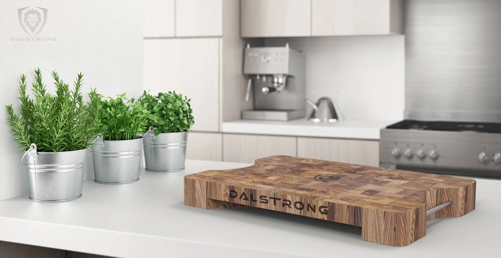 Lionswood | Teak Cutting Board | Medium Size | Dalstrong on top of a white kitchen table.