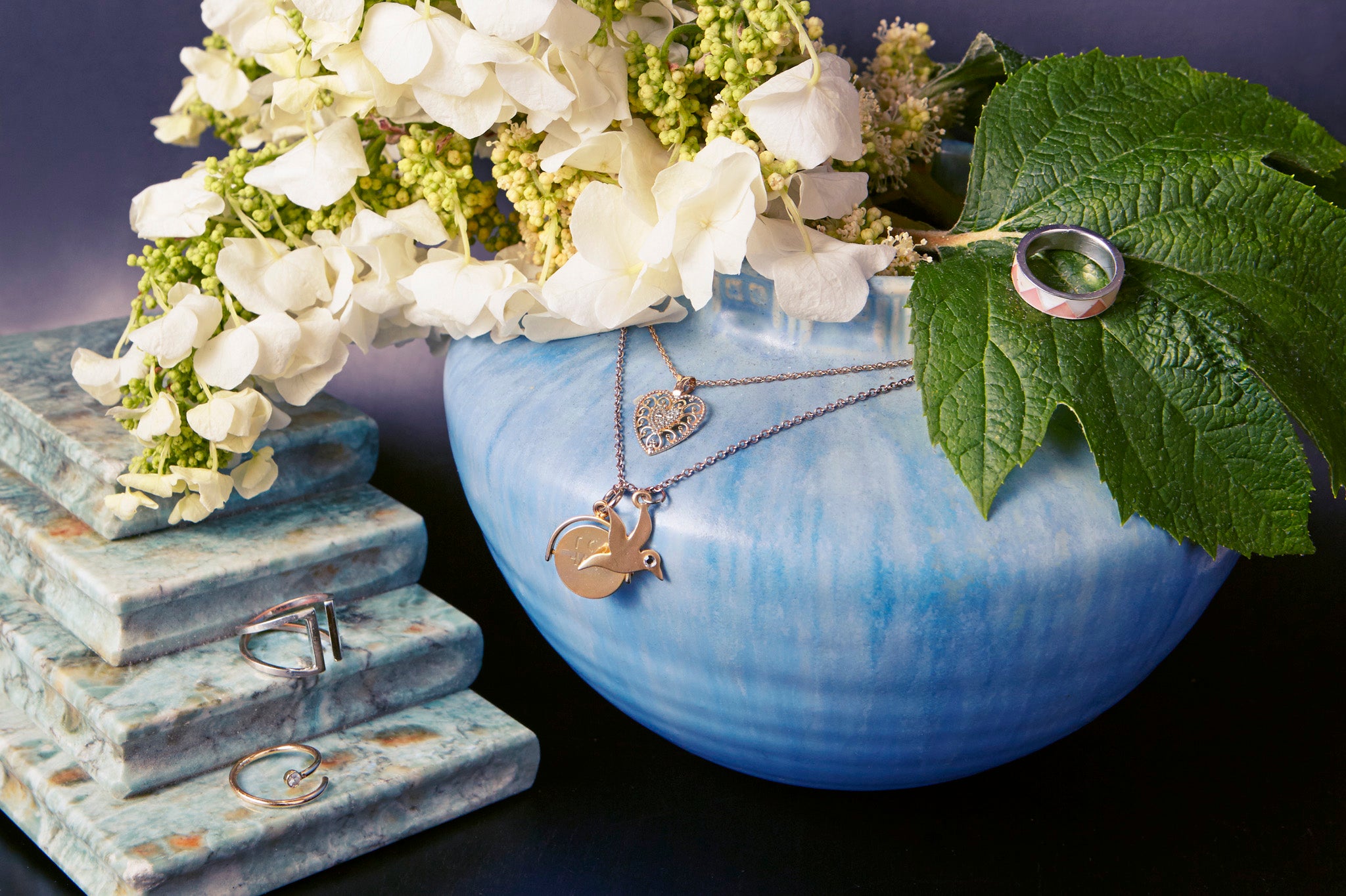 julia landauer's meaningful jewelry heart shaped necklace blue pot with flowers