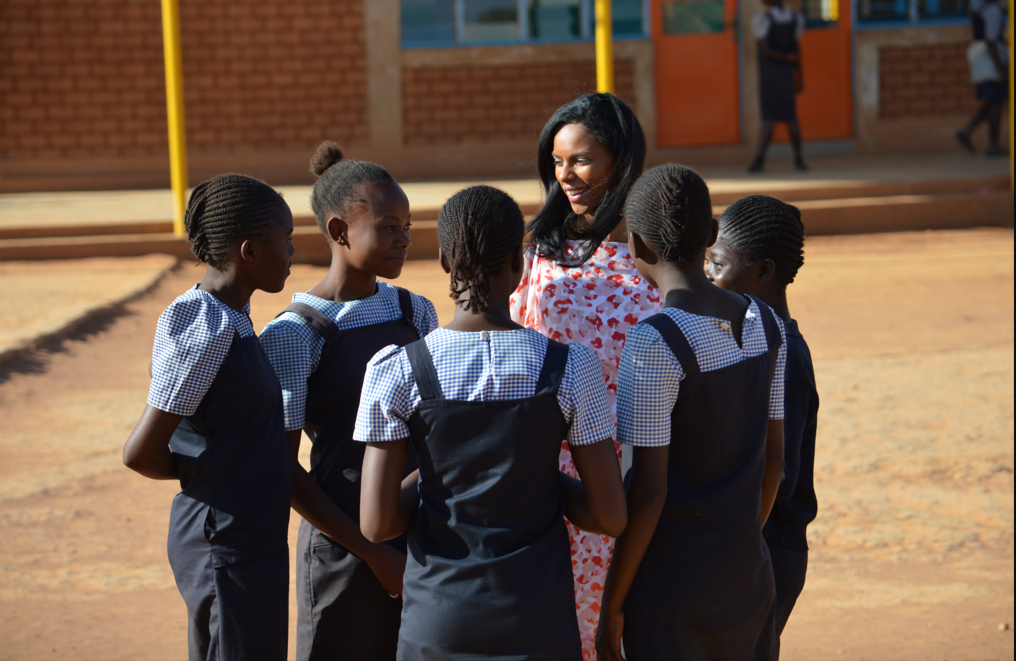 noella coursaris musunka international supermodel at malaika in drc with girls in school uniforms