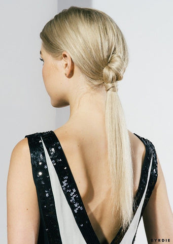 The knotted ponytail is a classy, easy hairstyle for women who are always on the go. 