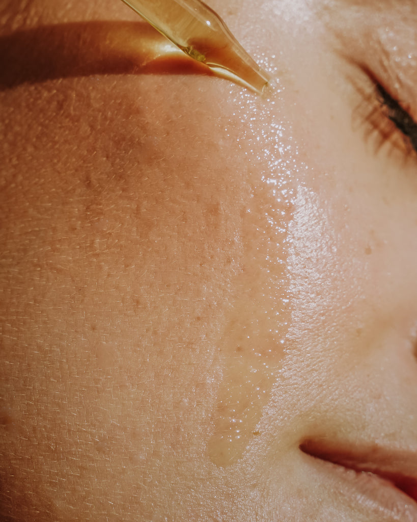 Woman With Face Oil Dripping Onto Face