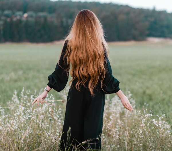 Woman in field with long har