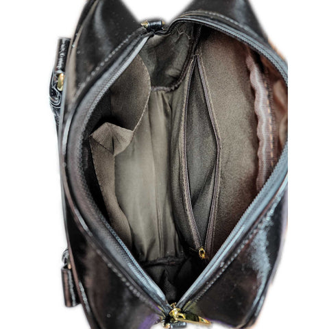 inside of satchel purse with one zipper pocket and two small open pockets
