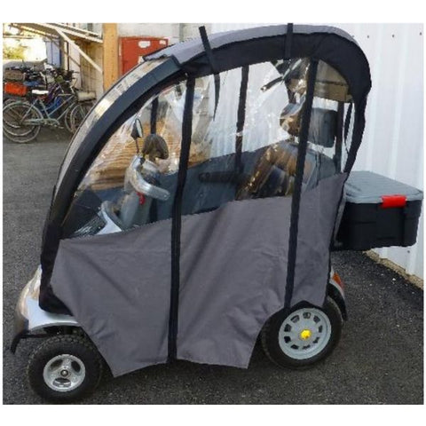 A white AFIKIM Afiscooter S4 four-wheel scooter with a hard top canopy and rain sides, designed for outdoor use.