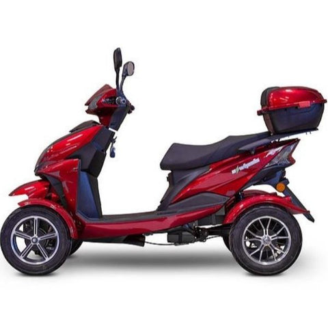 Image of a four-wheel scooter, specifically the E-Wheels EW-14 model, captured from the left side. The scooter is designed with a sleek and modern aesthetic, featuring a comfortable seat, handlebars, and a spacious footrest area. Its vibrant red color adds a touch of style. The four wheels provide stability and maneuverability, making it an ideal mobility solution for individuals seeking independence and convenience.