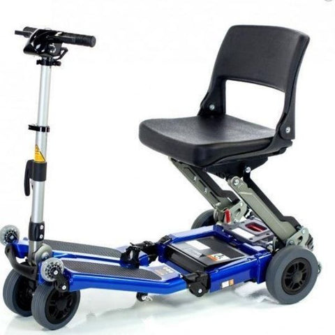 A blue foldable travel scooter with four wheels, known as the FreeRider USA Luggie Standard.