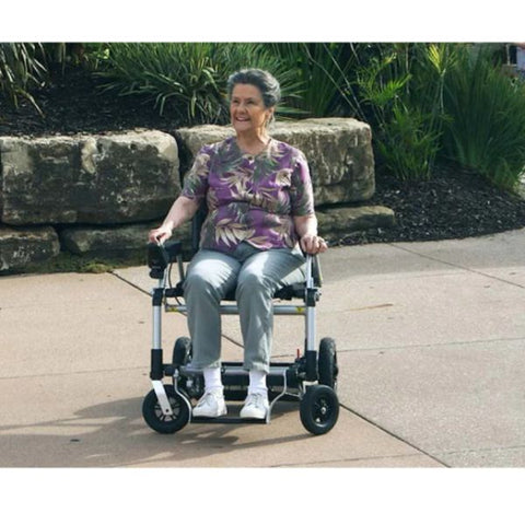 Lady riding the Journey Zoomer Chair conveniently outdoors