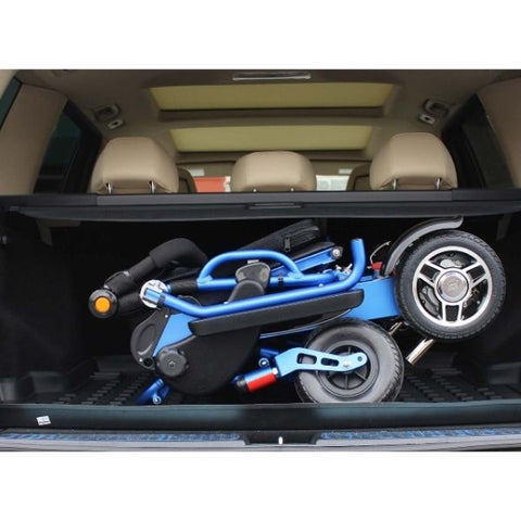 Pathway Mobility Geo Cruiser DX Folding Power Wheelchair Blue Folded in Trunk View