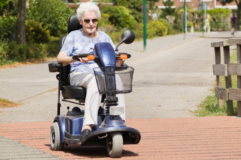 Senior riding mobility scooter