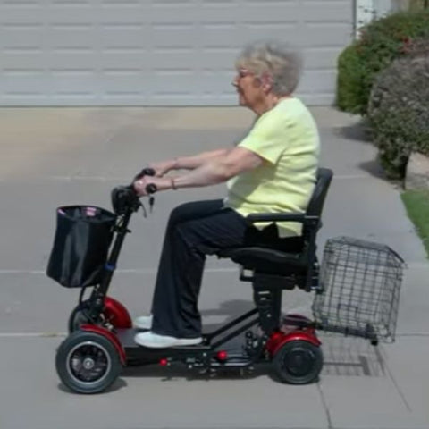 Lady riding the Red EW-22 4-Wheel Folding Mobility Scooter - Left Side View