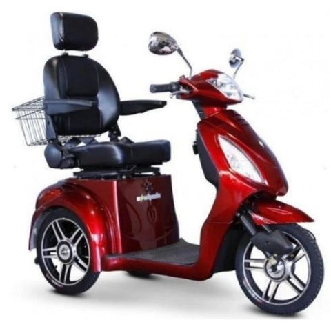 Image of a sleek and stylish electric scooter, the EW-36. The scooter is black in color and features a comfortable seat, handlebars, and large wheels. It is parked outdoors against a backdrop of greenery, suggesting a fun and eco-friendly mode of transportation.