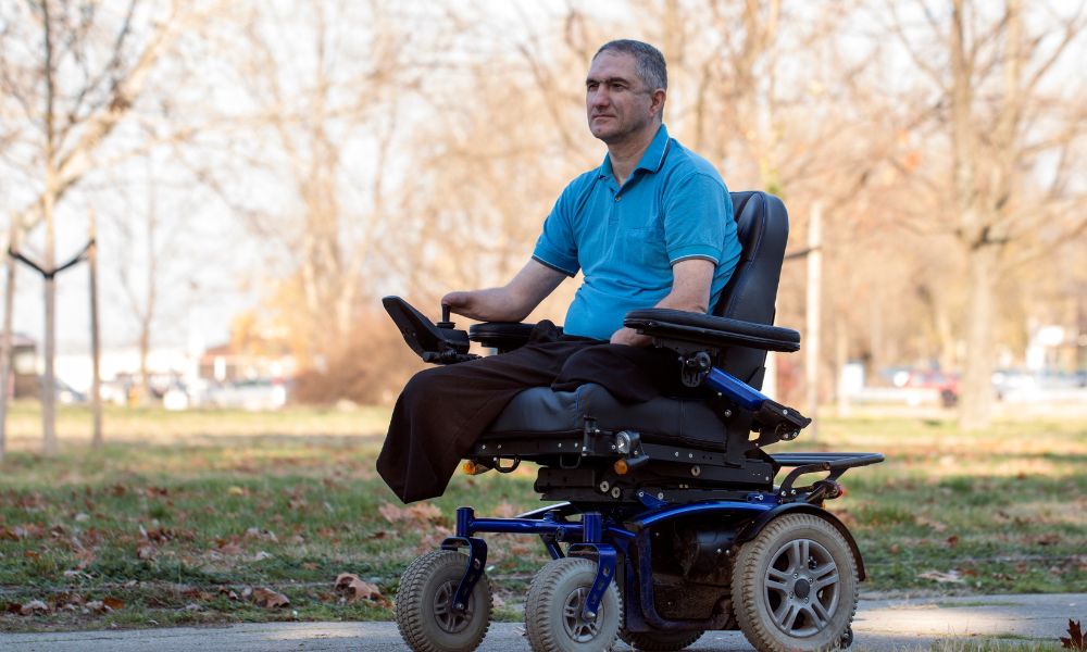 middle aged man using electric wheelchair