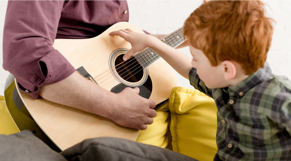 kid playing guitar