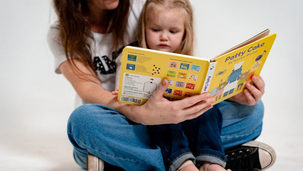 A mom is reading a musical picture book with her toddler girl. Itsy bitsy spider lyrics, itsy bitsy spider song, nursery rhymes, musical books for kids.