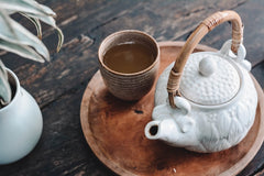 White teapot with bamboo handle