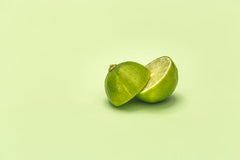 Cut limes on a green background