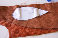 moth body pattern pinned to a double layer of orange velvet