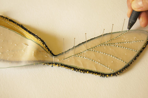 paper pattern pinned to other wing, 6 pins directly in top vein, into fabric, vertical and frixion pen used to mark dots at pin pricks