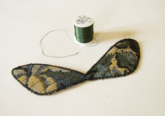 veins stitched on front of wings plus a spool of Decora machine embroidery thread in forest green