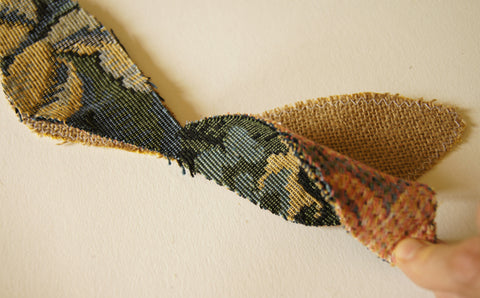 mainn tapestry fabric placed face up on the burlap