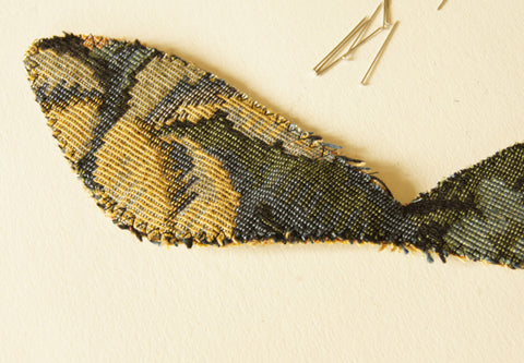 Three layers of wing fabrics stitched together around the edges with long and wide zigzag stitch