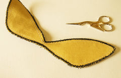the back of the moth wings, a solid yellow fabric