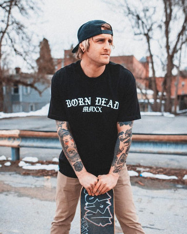 skateboarder wearing born dead clothing