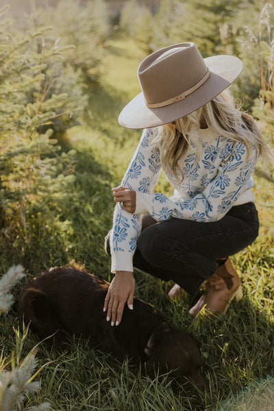 model petting a dog