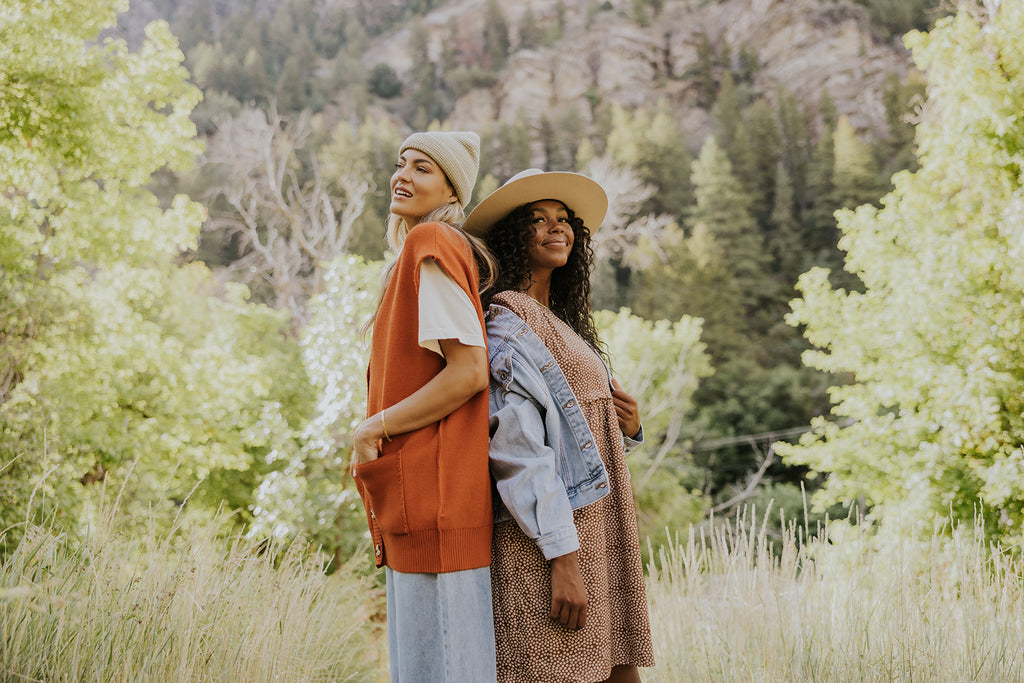 two women wearing fall clothing