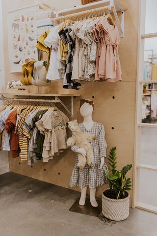 kids' clothing display at ROOLEE Fashion Place