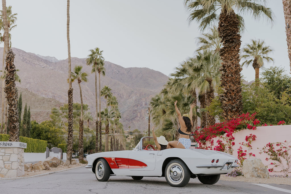 women driving a corvette in palm springs