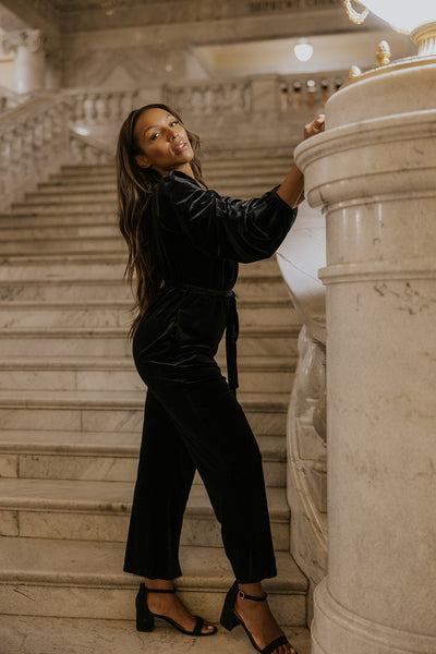 model wearing a velvet jumpsuit