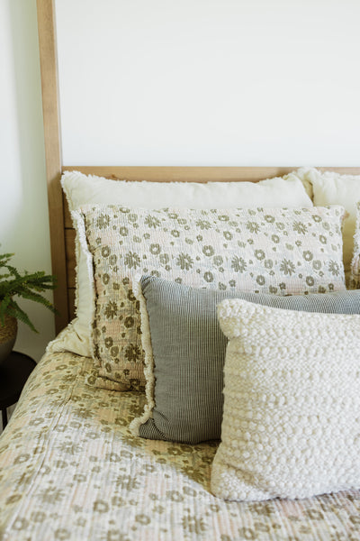 throw pillows on a bed