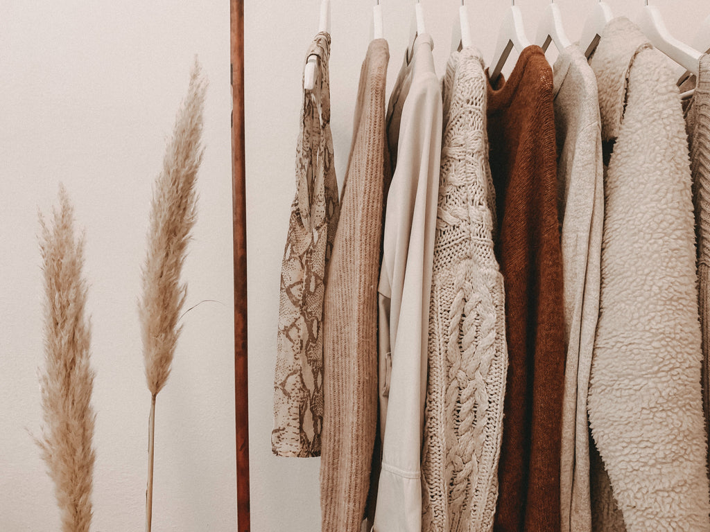 Neutral clothing rack. Photo by Alyssa Strohmann on Unsplash