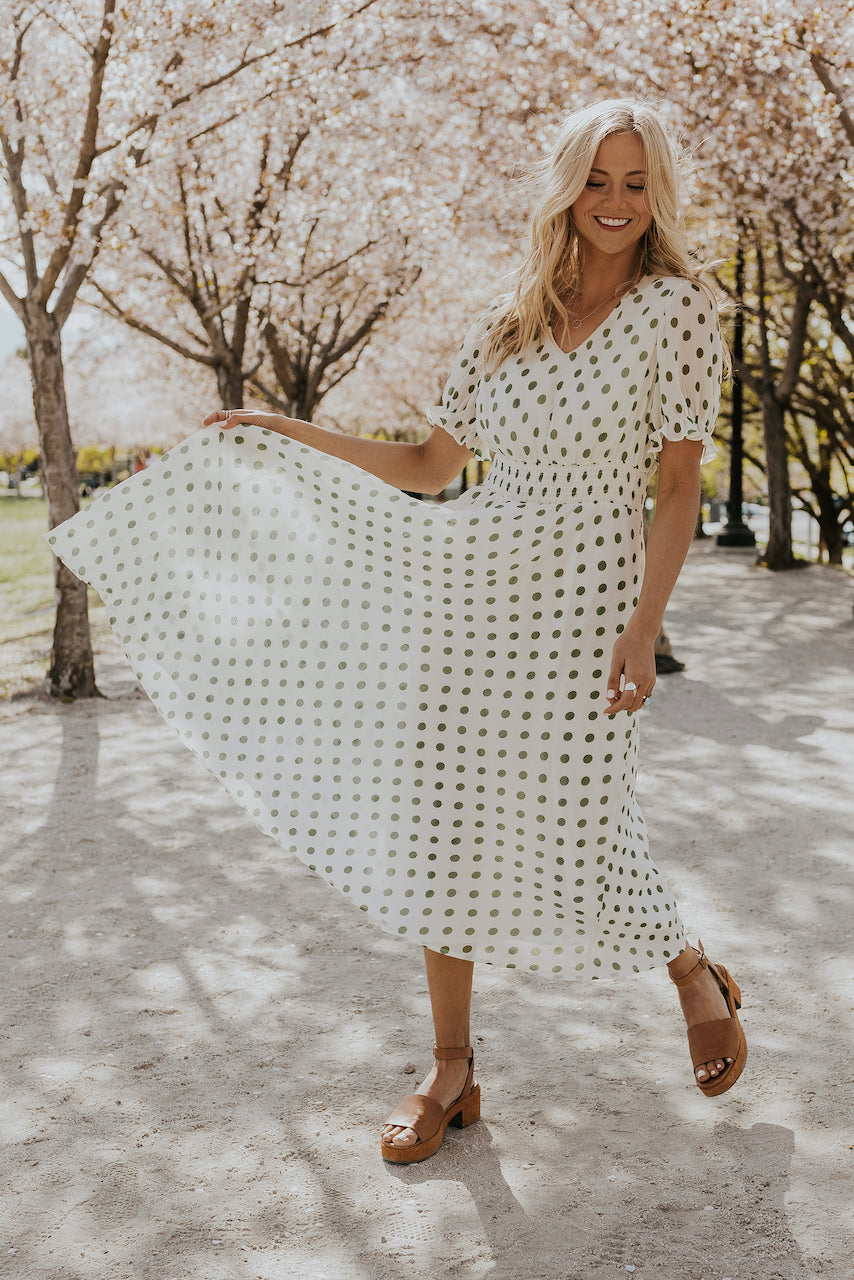 green dress with white polka dots