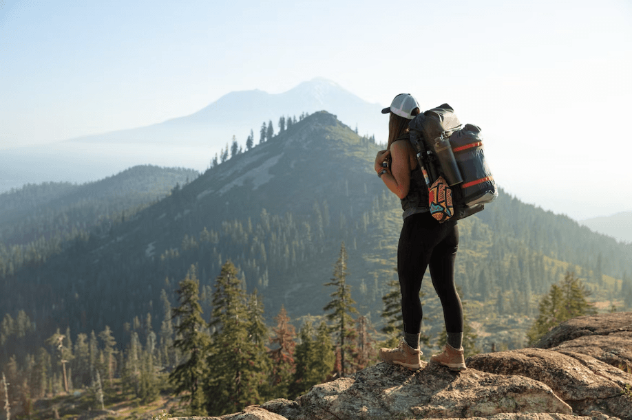 Female hiker standing on a hill