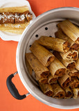 pot with pumpkin tamales