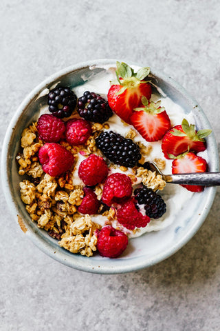 granola and yogurt fruit and nut bowl