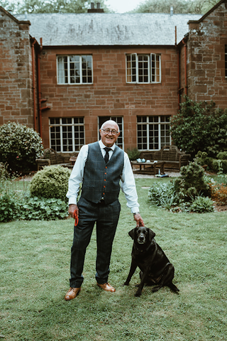 man with dog in 2 piece suit