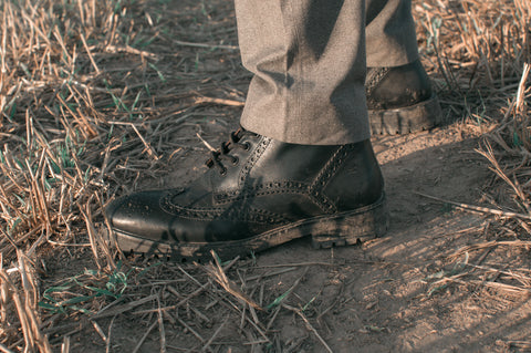 black mens brogue billy boots in field