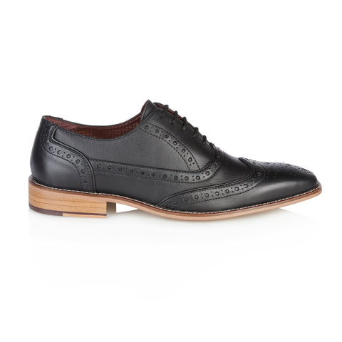 Side view of a single black Sidney brogue shoe