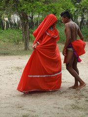 wayuu woman in red and man dancing