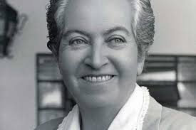 woman smiling with her teeth in black-and-white