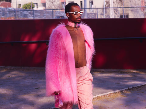 Black-man-wearing-pink-jacket-and-matching-pink-choker-necklace