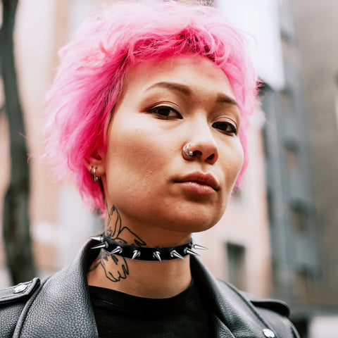 woman-with-short-pink-hair-wearing-a-bodyj4you-choker-with-metal-spikes