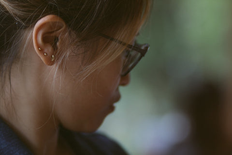 woman-wearing-earrings-after-doing-piercing-aftercare